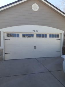 Massive double garage doors on tan building