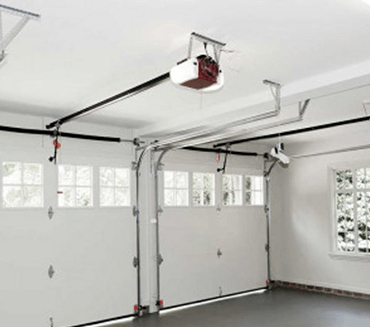 Garage Door Opener Repair completed for a white garage with two doors