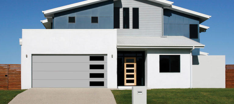 modern home with a grey flush panel garage door