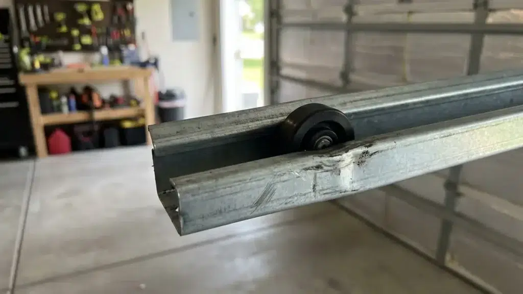 garage door track that is bent and damaged