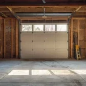 Exposed garage wall insulation showing signs of wear, helping determine does insulation need to be replaced in Fort Collins homes